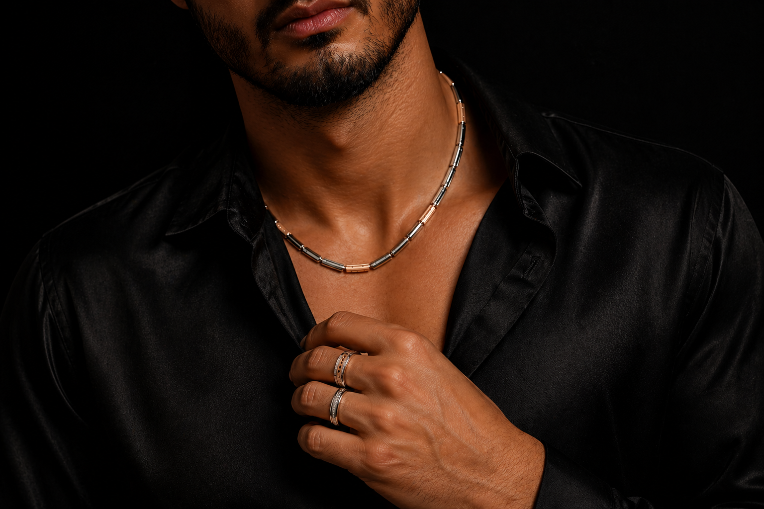 Man wearing diamond rings and gold chain with black shirt, luxury jewelry styleMan wearing diamond rings and gold chain with black shirt, luxury jewelry style